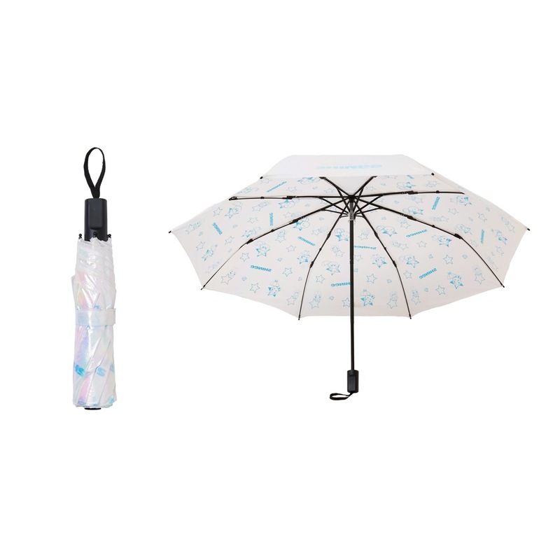 A folding umbrella shown folded and open with a white canopy patterned with small blue illustrations.
