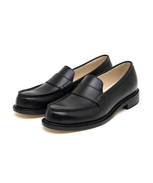 Angled front view of a pair of black FT leather loafers with leather sole.