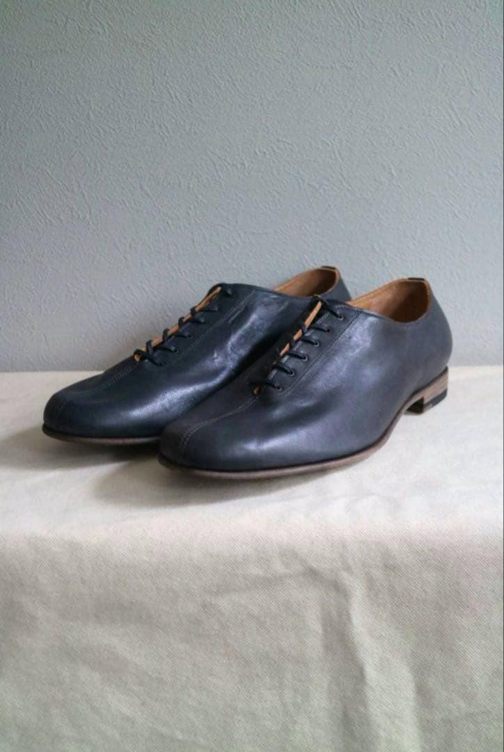Pair of forme fm-80 / Incal Horse Dance leather loafer shoes shown at a three-quarter angle on a cloth surface.