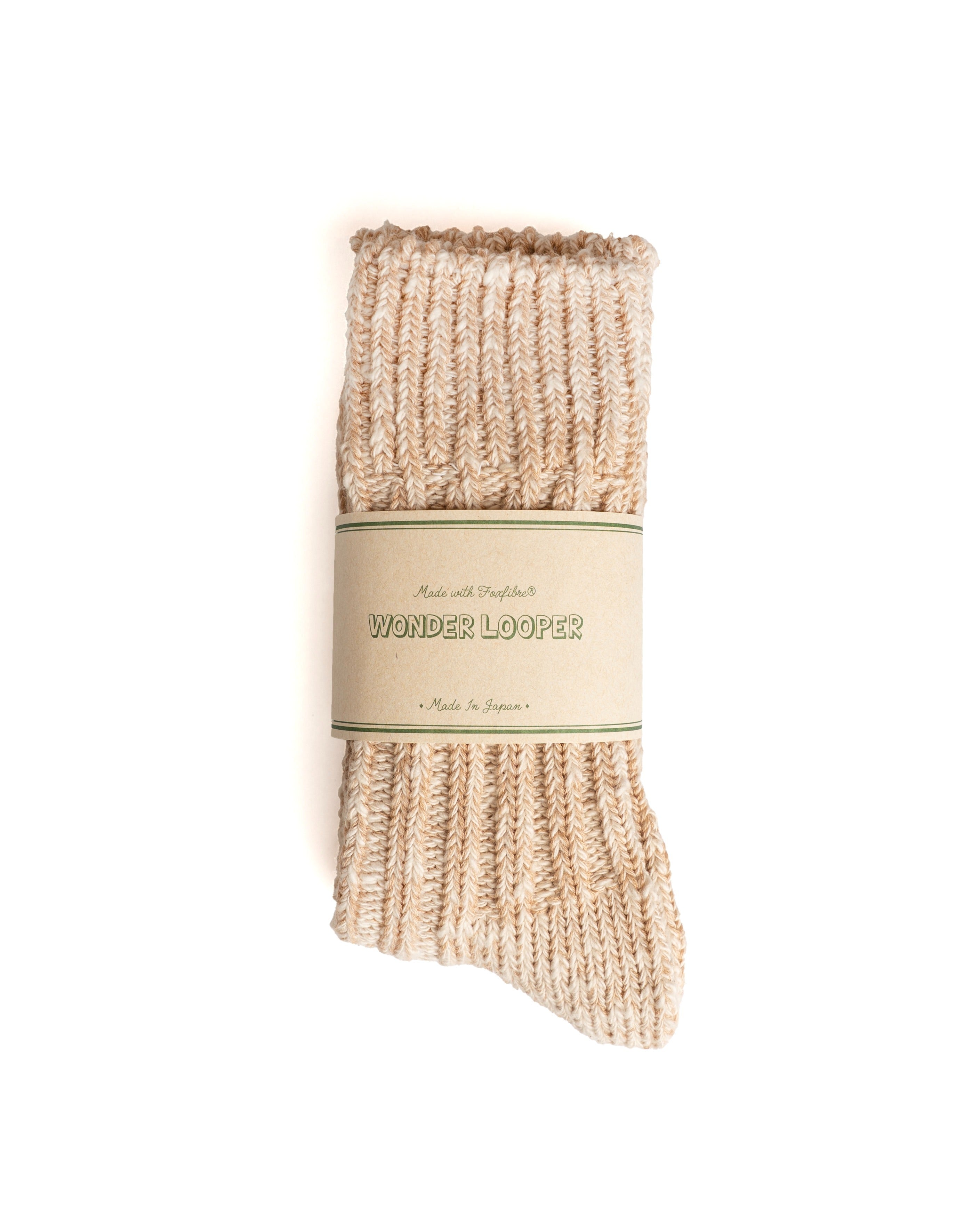 Folded Low Gauge Moku Foxfibre® men's sock in coyote color wrapped with a paper band label on a white background.