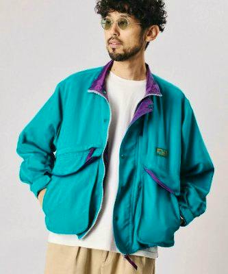 Model wearing the Foxfire × FREAK'S STORE New Destination JKT in teal shown from the front.
