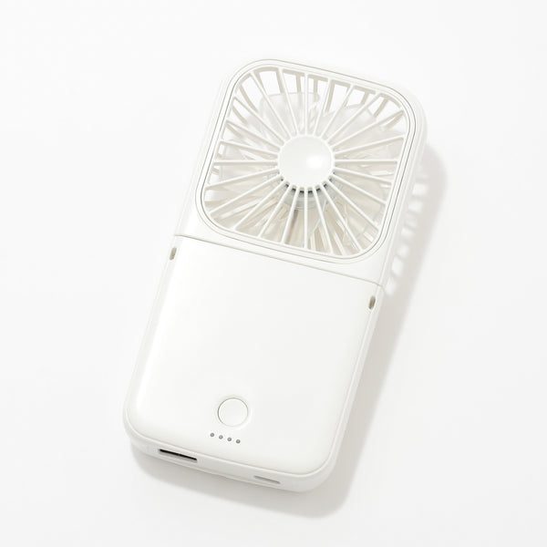 White smart handheld fan lying on a white background showing the fan grille, power button, LED indicators, and a charging port.