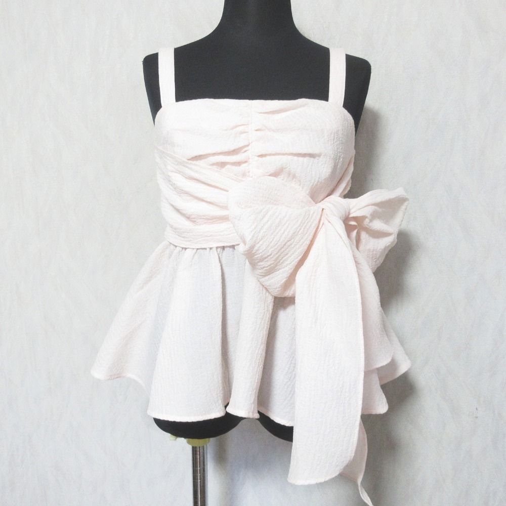 Light pink sleeveless 2-way ribbon top (women's polyester) shown on a black dress form.