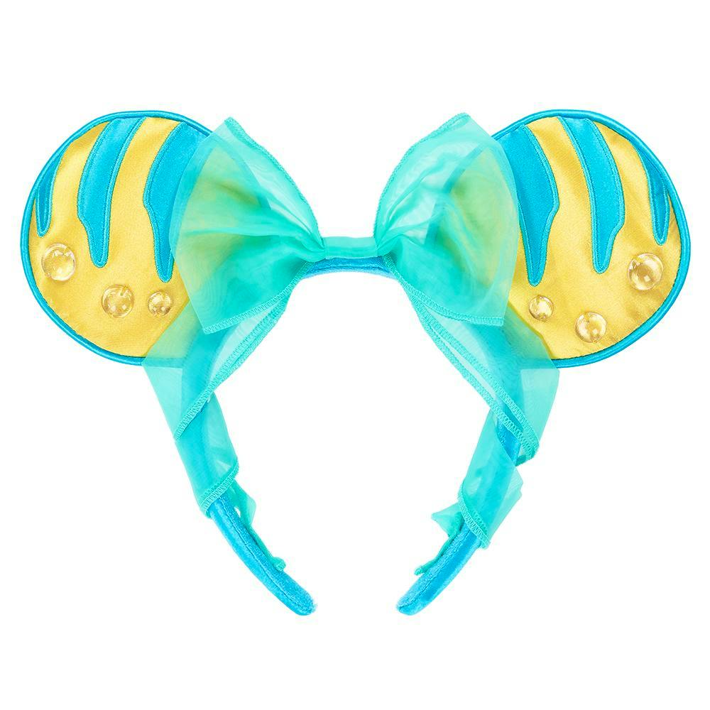 A turquoise and yellow decorative headband with round ears and a sheer bow on a white background.