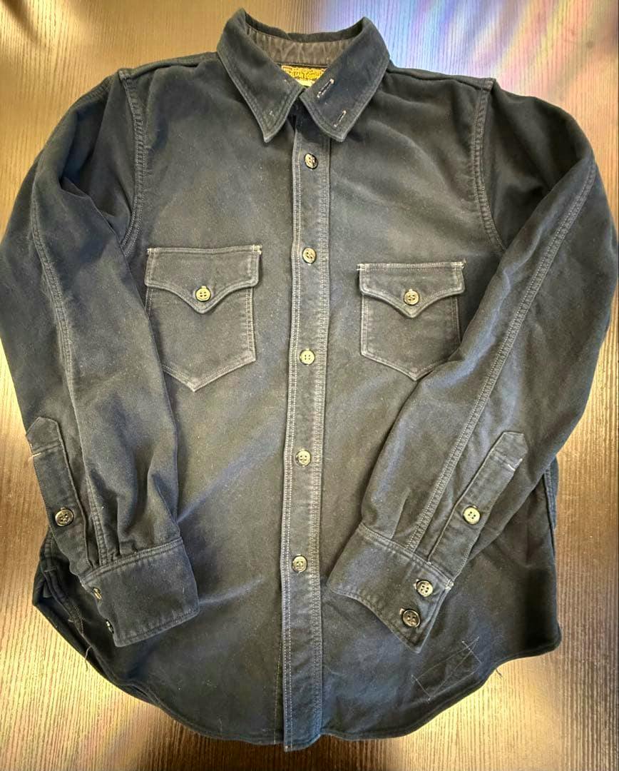 Front view of the Freewheelers men's deck shirt laid flat showing buttons, flap chest pockets, and long sleeves.