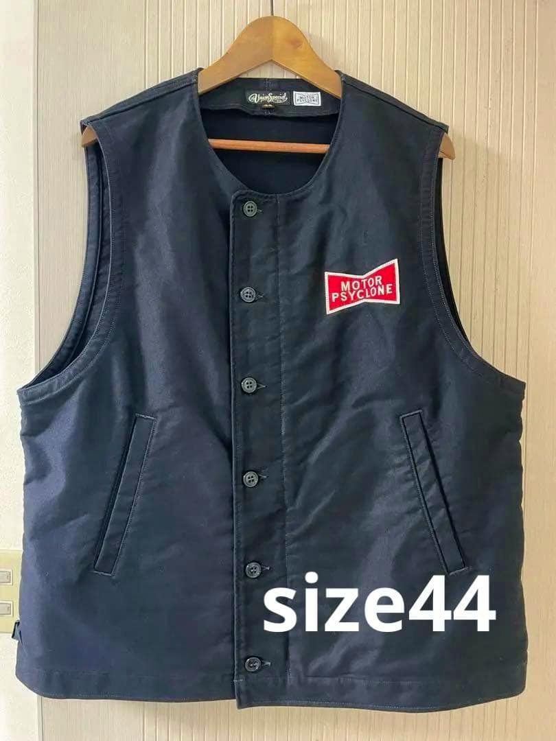 Front view of a dark polyester FREEWHEELERS deck worker vest on a wooden hanger showing button closure and a chest patch, with "size44" text overlay.