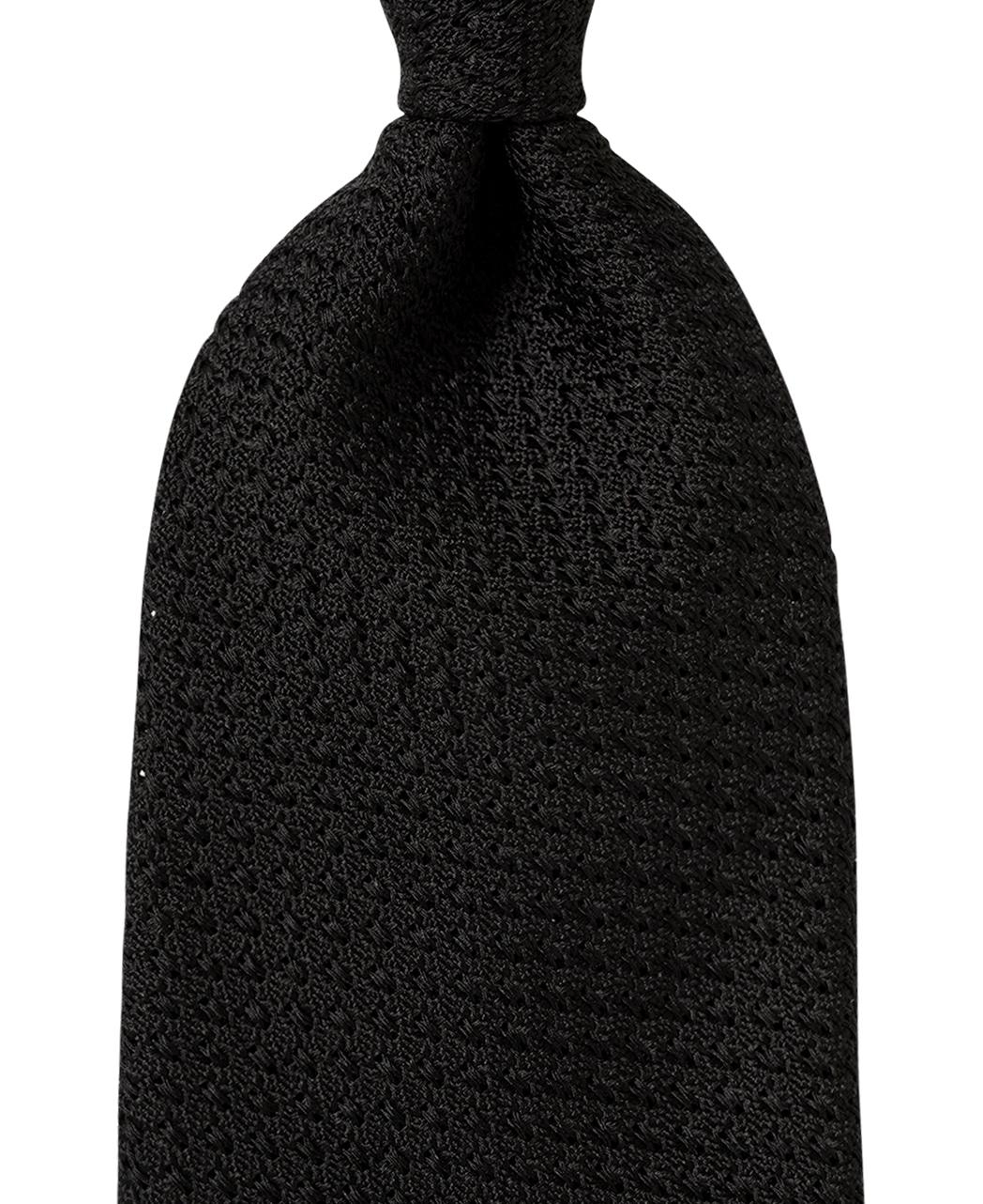 Close-up of a black textured silk necktie tied with a knot on a white background.
