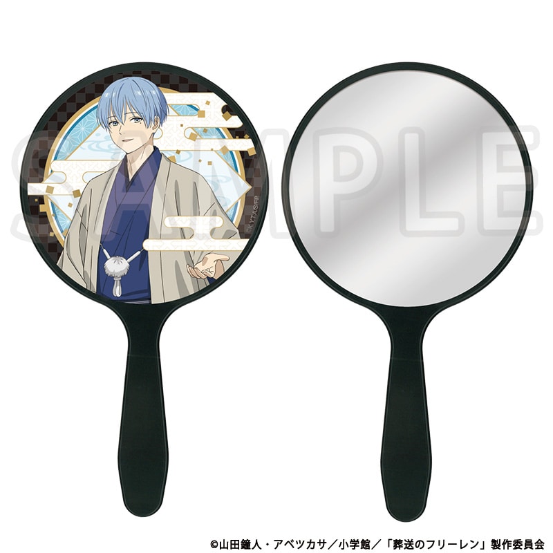 Round handheld framed mirror showing a printed illustration of Himmel from 葬送のフリーレン on one side and a reflective mirror on the other.