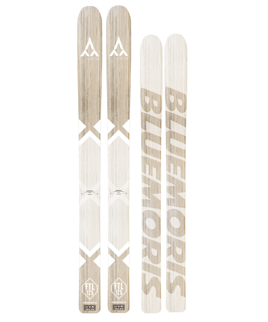 Two FTL 125 skis showing both tops and bases against a black background.