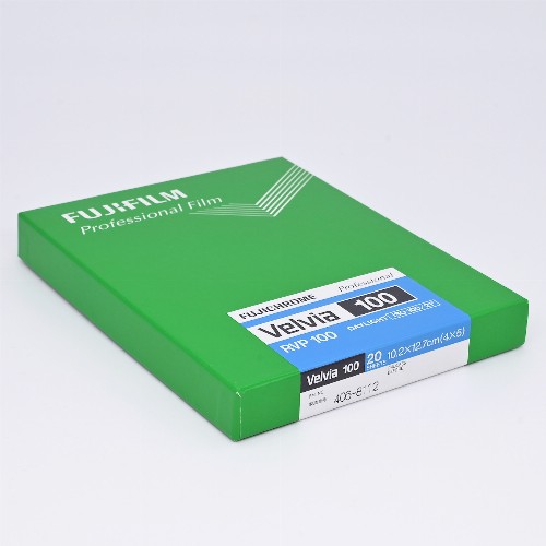 Green Fujifilm Velvia 100 4x5 film box labeled for 20 sheets on a white background.