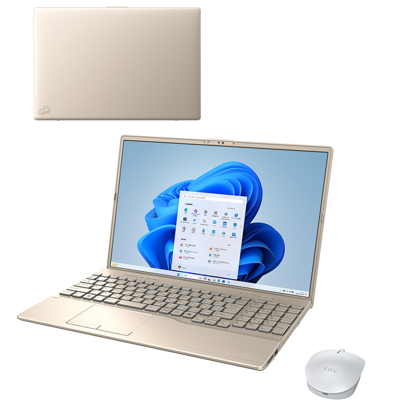 Open gold-colored FMV A77-K3 laptop displaying the Windows desktop, its top cover, and a white wireless mouse.