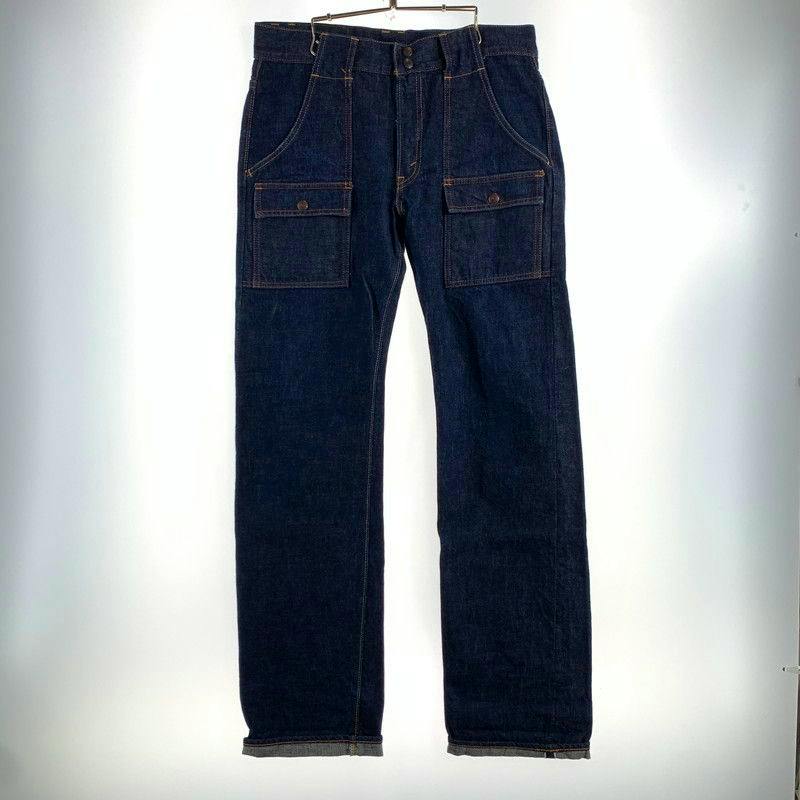 Front view of dark denim bush pants (Full Count 1246) hanging on a hanger.