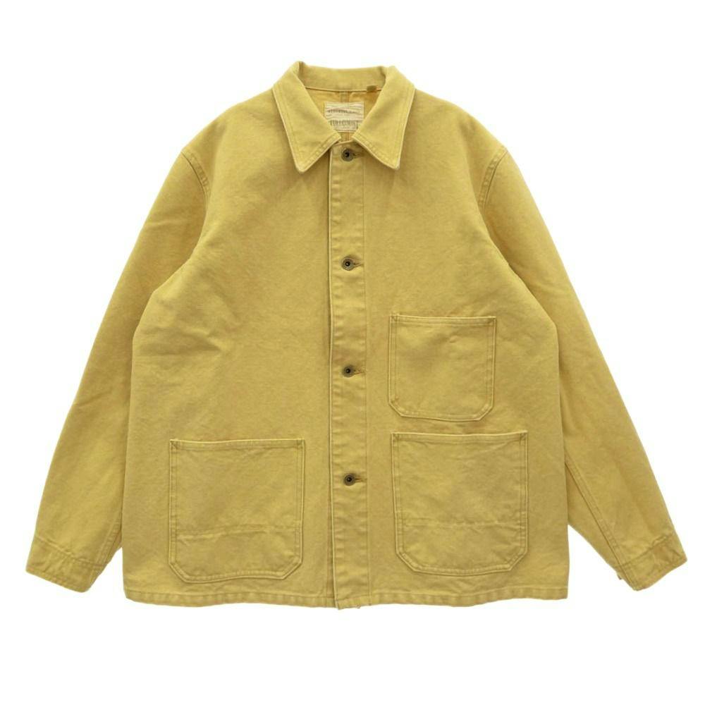Front view of a yellow heavy canvas chore jacket with three patch pockets and button closure.
