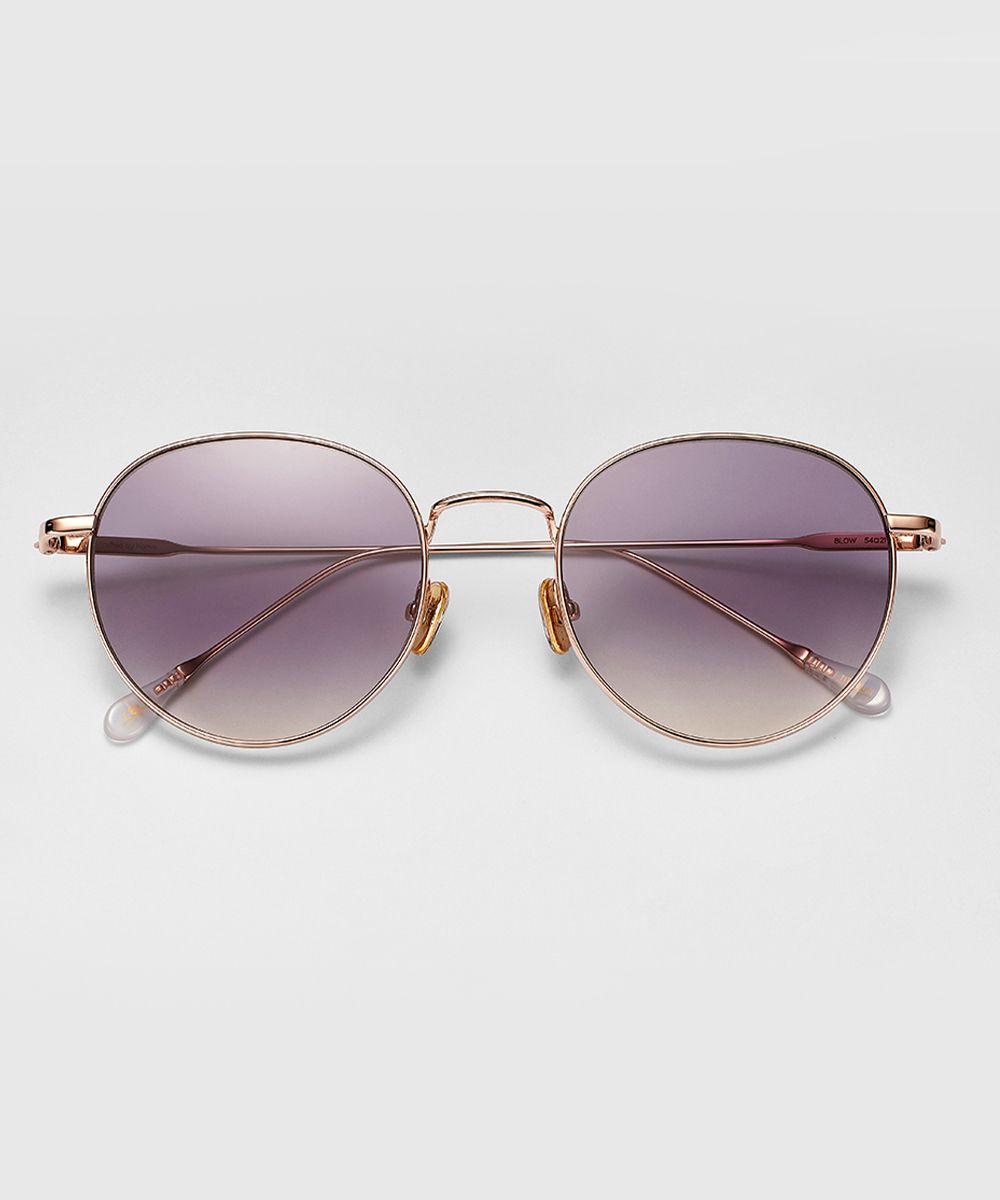 Front view of FUN THE MENTAL sunglasses with round purple gradient lenses and thin gold metal frame.