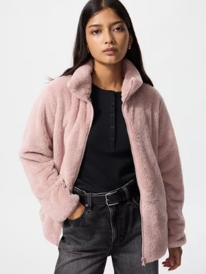 Woman modeling a pink furry fleece full-zip women's jacket, front view.