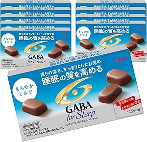 Multiple boxes of GABA for Sleep Smooth Milk chocolate shown with several chocolate pieces visible on the packaging.