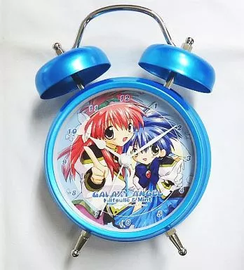Blue twin-bell alarm clock showing Millfeuille Sakuraba and Mint Blancmanche character illustration on its face.