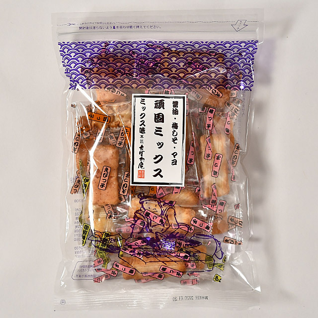 Clear plastic bag of packaged rice crackers labeled 頑固ミックス, showing multiple individually wrapped crackers and a purple wave design at the top.