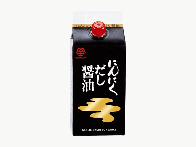 Front view of a black 200ml carton of にんにくだし醤油 (garlic dashi soy sauce) with a red cap and gold front graphic.