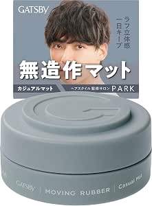 Round gray container of Gatsby Moving Rubber Casual Mat hair wax shown with a cropped photo of a male model and Japanese text in the background.