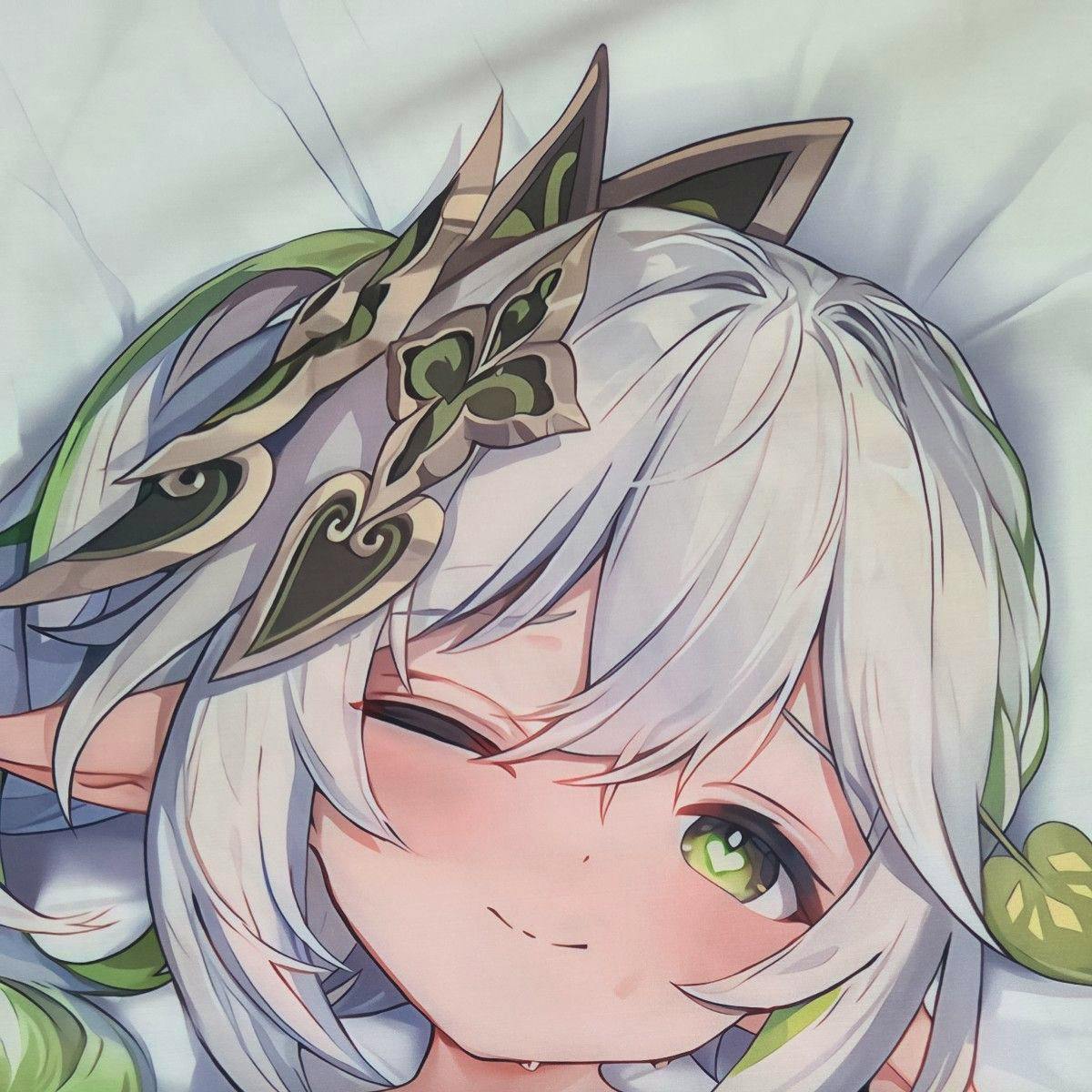 Close-up photo of the polyester pillow cover showing the printed anime character Nahida's face with white hair and green eyes.