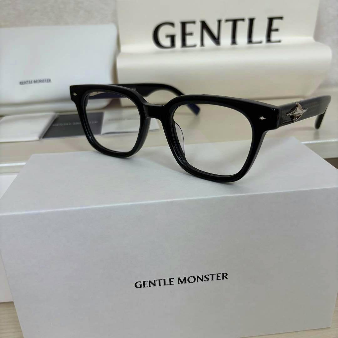 Black Gentle Monster ALTO eyeglasses with clear lenses shown on top of a Gentle Monster box.