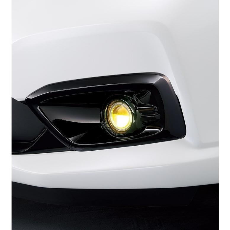 Close-up of the Genuine Honda Civic Type R LED fog light unit installed in a white car's front bumper.