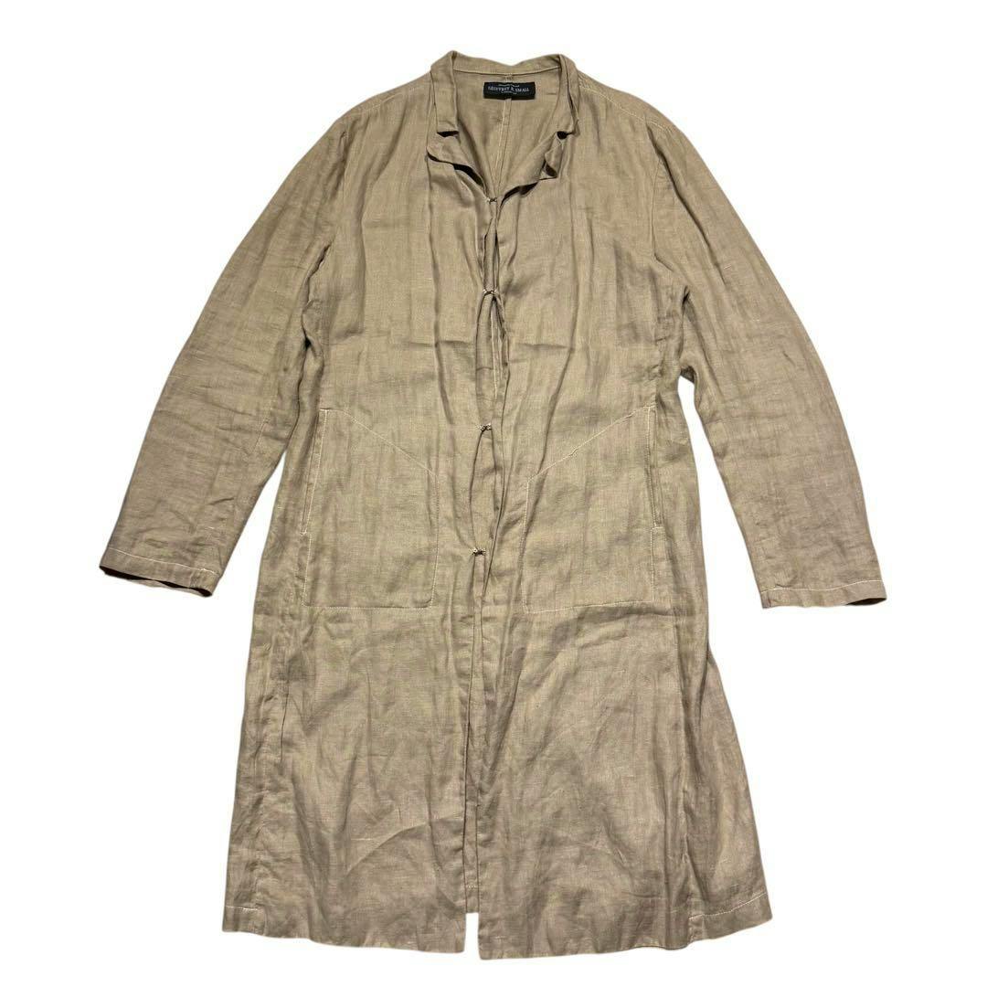 Front view of a GEOFFREY B. SMALL linen long coat laid flat showing the hook-button closure and two front pockets.