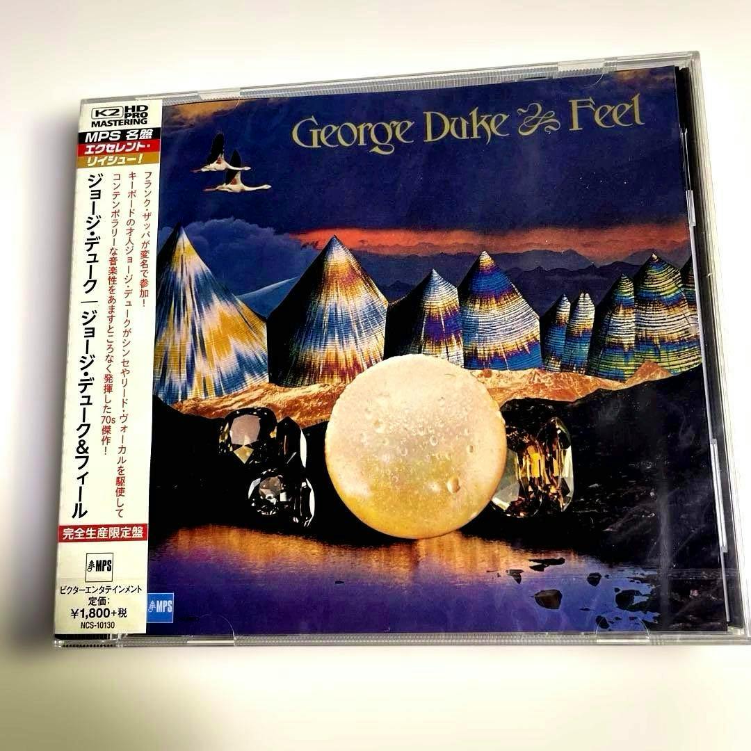 Sealed CD case showing the front cover artwork for George Duke & Feel with a Japanese obi strip at the left.