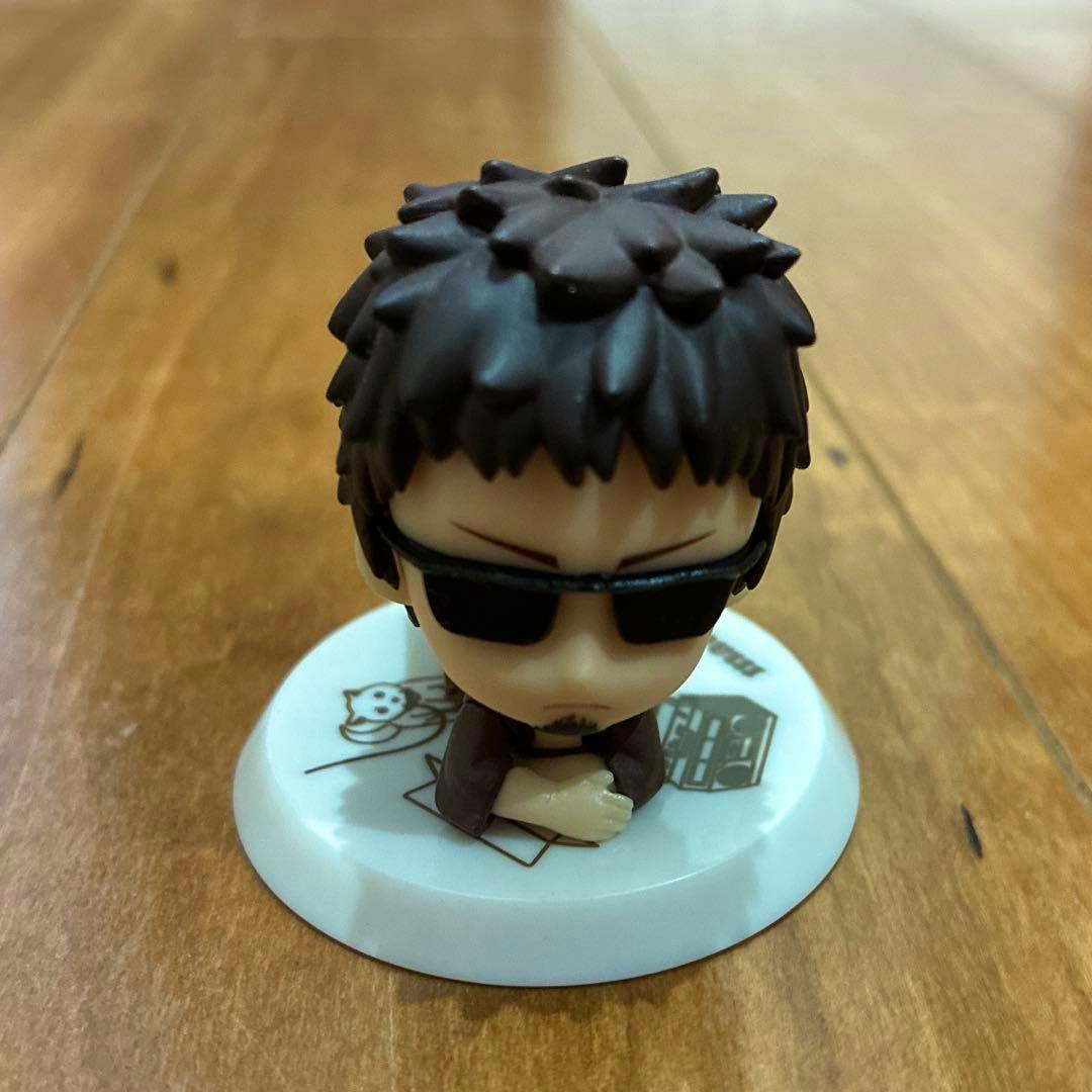 Front view of a small plastic chibi figure of "Madao" from Gintama seated on a white display base.