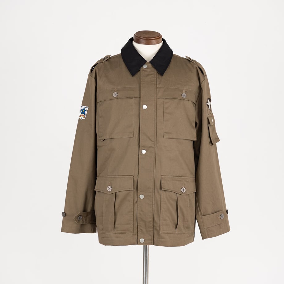 Front view of an olive-green military-style men's cotton jacket with a black collar displayed on a mannequin.