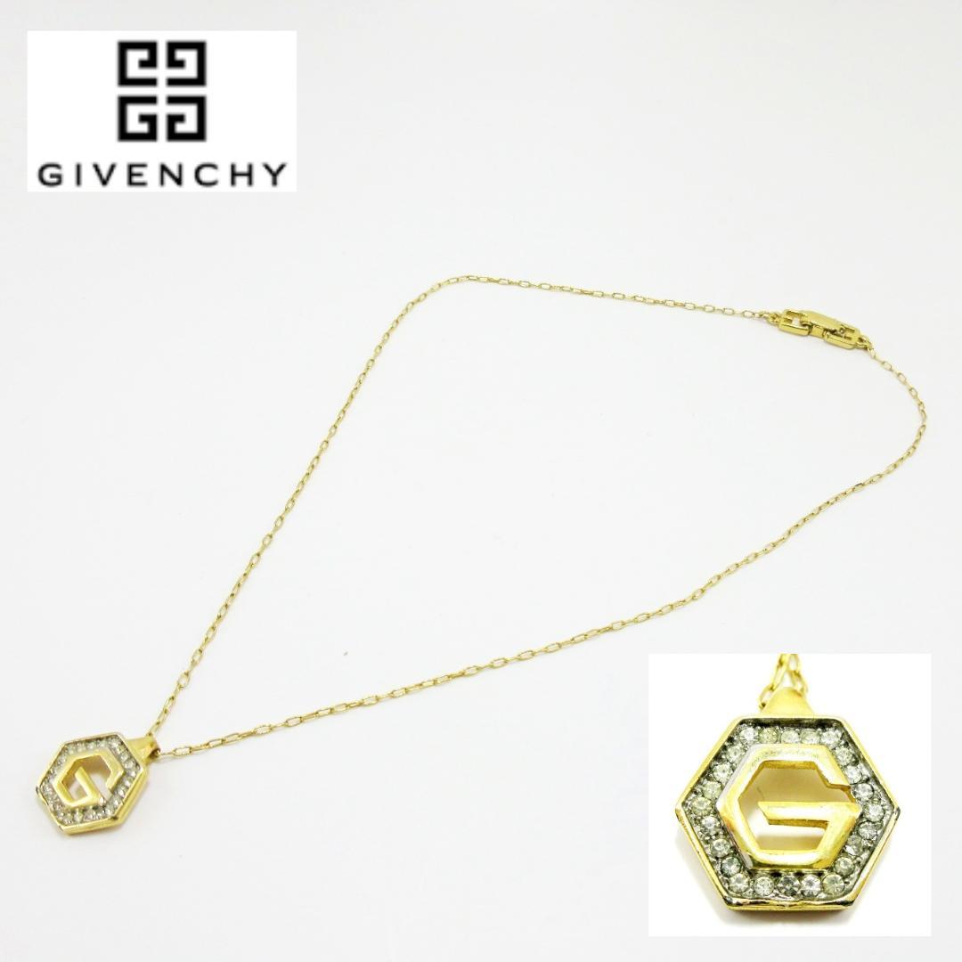 Gold-tone Givenchy necklace with a hexagonal rhinestone-encrusted pendant displayed on a white background.