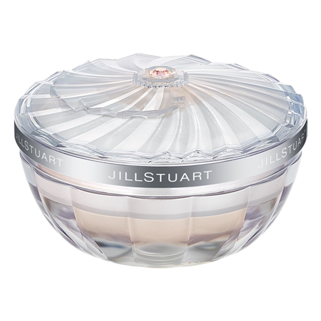 Clear decorative round jar of the Glow Chiffon Lasting Loose Powder with a faceted lid and visible powder inside.