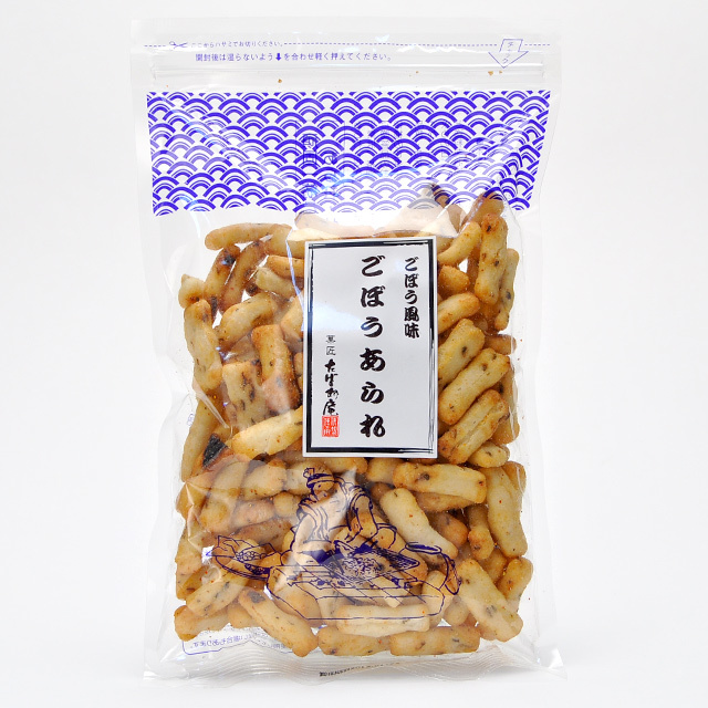 A clear plastic package of ごぼうあられ (packaged rice crackers) showing the crackers and label.