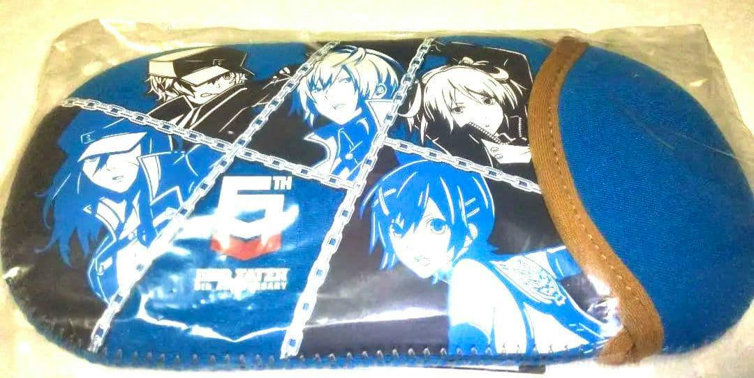 Front of the GOD EATER 5th Anniversary multi-case pouch showing blue polyester fabric and character artwork.