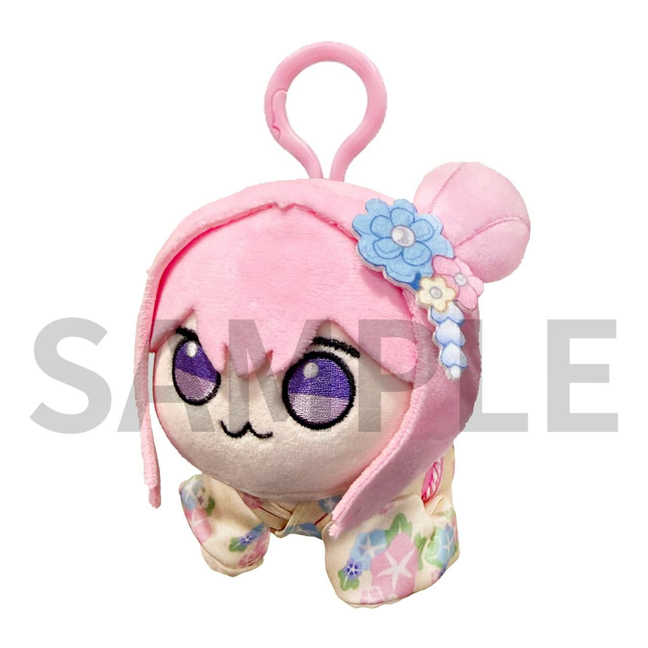 Front view of the pink-haired NIKKE plush keychain DORO wearing a floral kimono and attached to a pink plastic clip.
