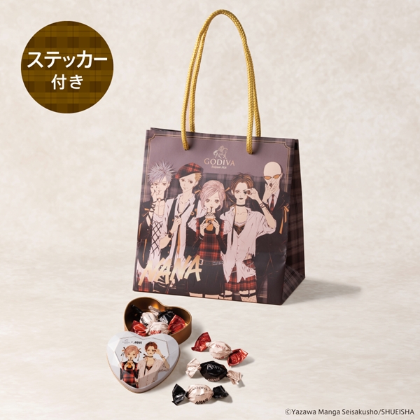 Wrapped Godiva chocolates shown with a Godiva×NANA illustrated gift bag and sticker.