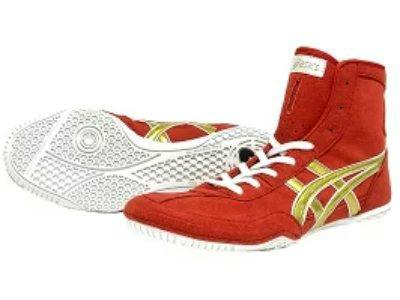 A pair of red leather high-top boots with gold side stripes, white laces, and white rubber soles.