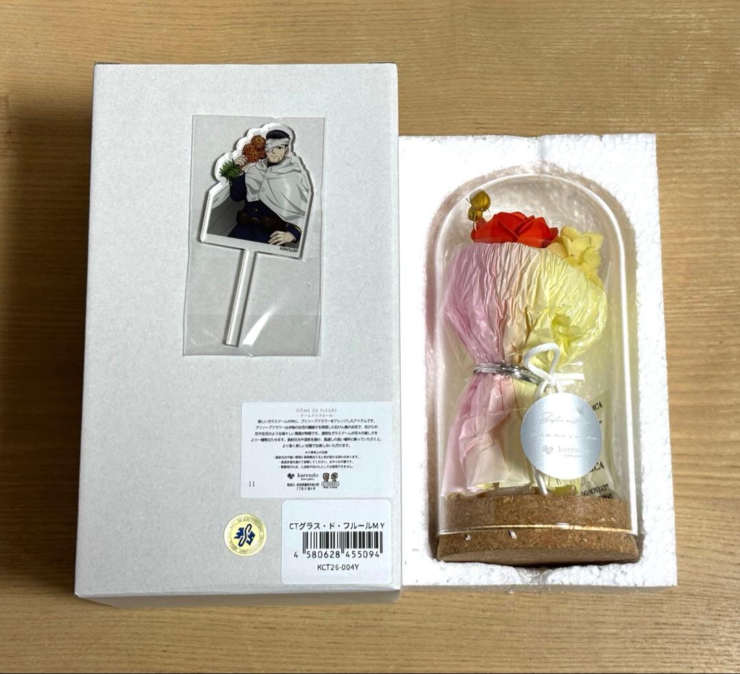 Glass dome flower (Golden Kamuy collaboration) with multicolored preserved flowers and a cork base shown next to its white box featuring character artwork.