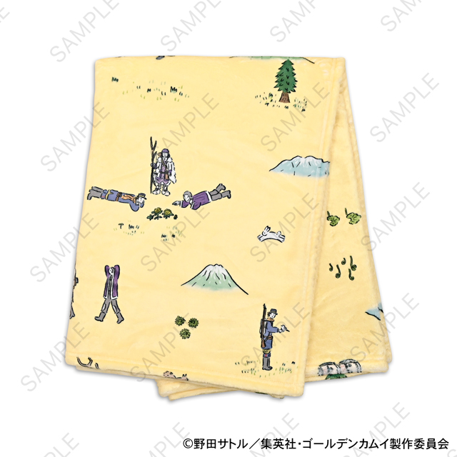 Folded yellow polyester blanket with small printed character illustrations shown on a white background.