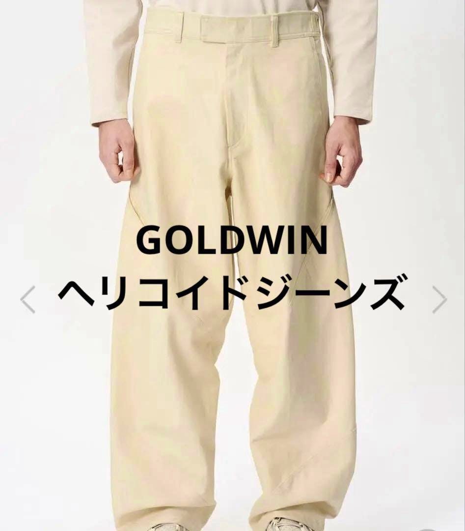 Front view of bone-white GOLDWIN Helicoid Jeans worn by a model, showing the pants from waist to hem.