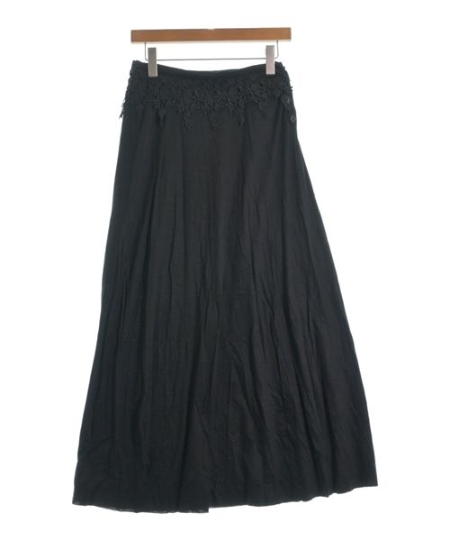 Black long maxi cotton women's skirt hanging on a wooden hanger against a white background.