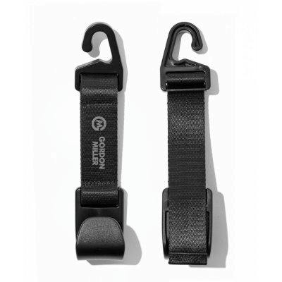 Two black GORDON MILLER seat hooks with straps shown on a white background.