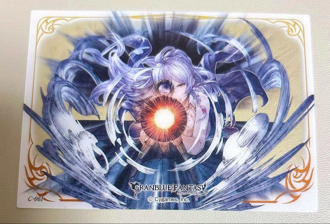 Photograph of a Granblue Fantasy clear plastic card featuring Silva artwork with a glowing central energy effect and the Granblue Fantasy logo.