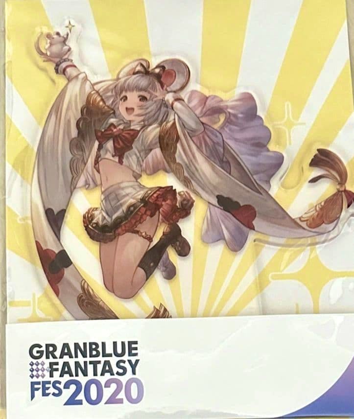 Photo of the sealed Granblue Fantasy acrylic stand packaging showing the character artwork and the 'GRANBLUE FANTASY FES 2020' logo.