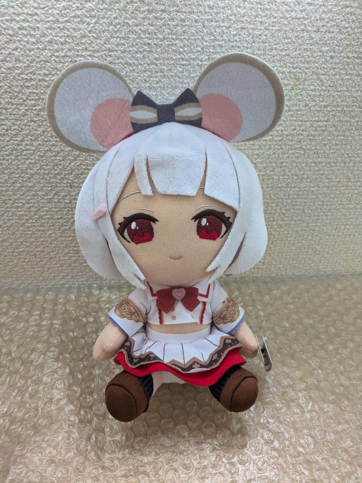 Front view of the グランブルーファンタジー ビカラ ぬいぐるみ plush seated on bubble wrap against a textured wall.