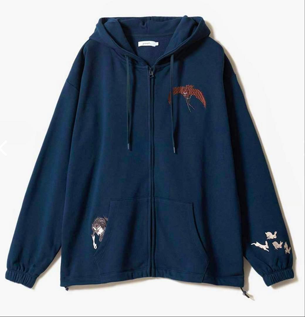 Front view of a navy zip-up hoodie with a hood, drawstrings, kangaroo pocket, and small character-themed embroidered designs on the chest, pocket, and right sleeve.