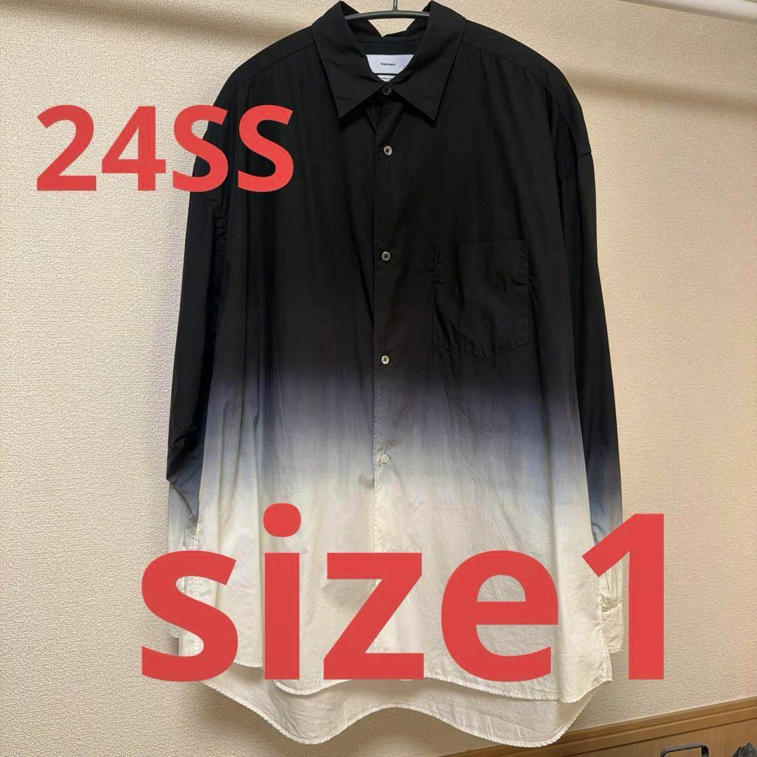 Front view of a men's long-sleeve oversized shirt hanging on a hanger showing a black-to-white gradient.