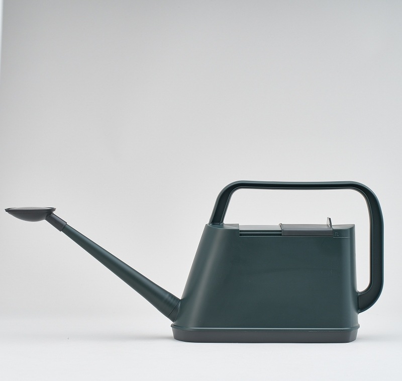 Green plastic watering can (6L) with a long spout and top handle on a white background.