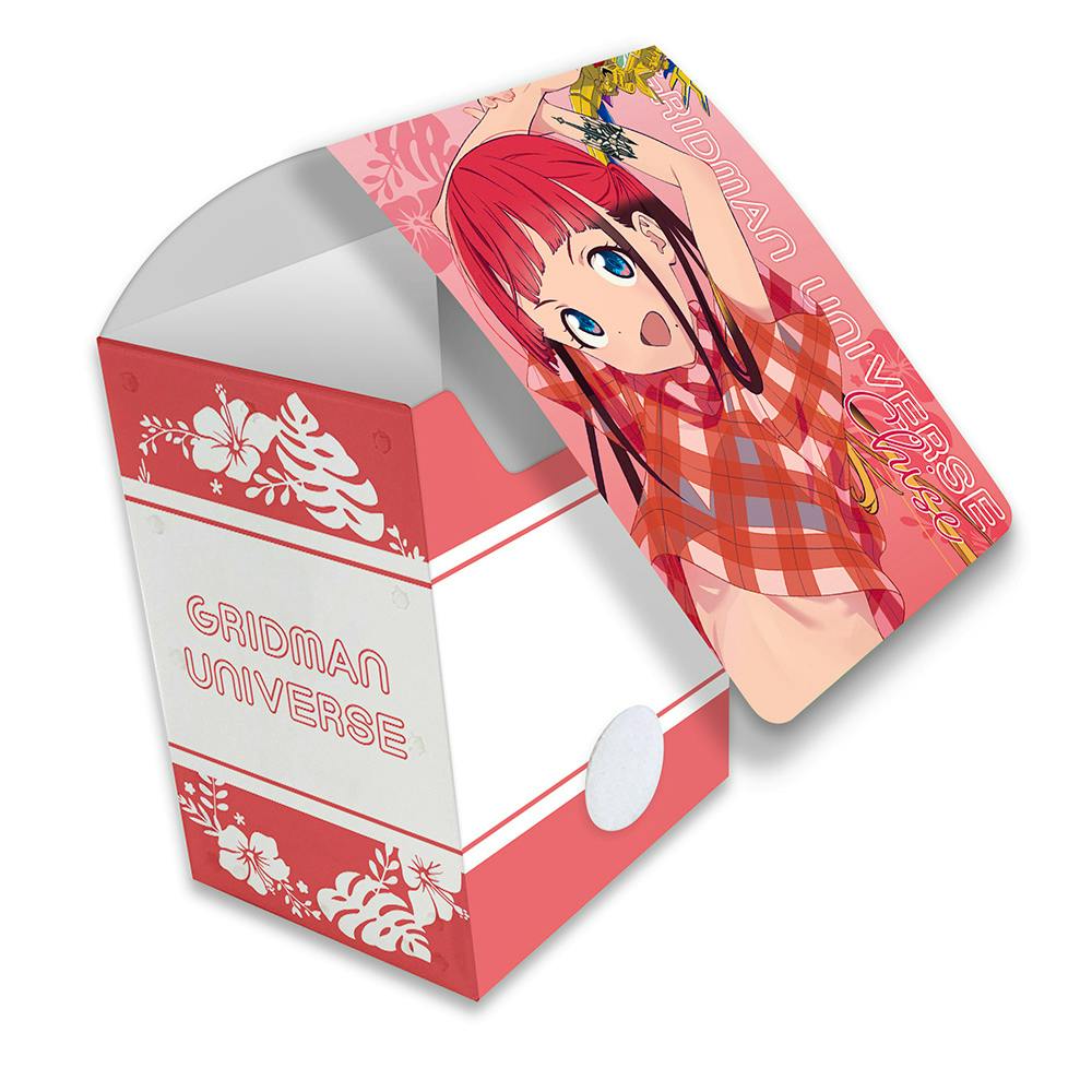 A plastic card case for "Gridman Universe" showing a pink floral case and a card featuring a red-haired anime girl.